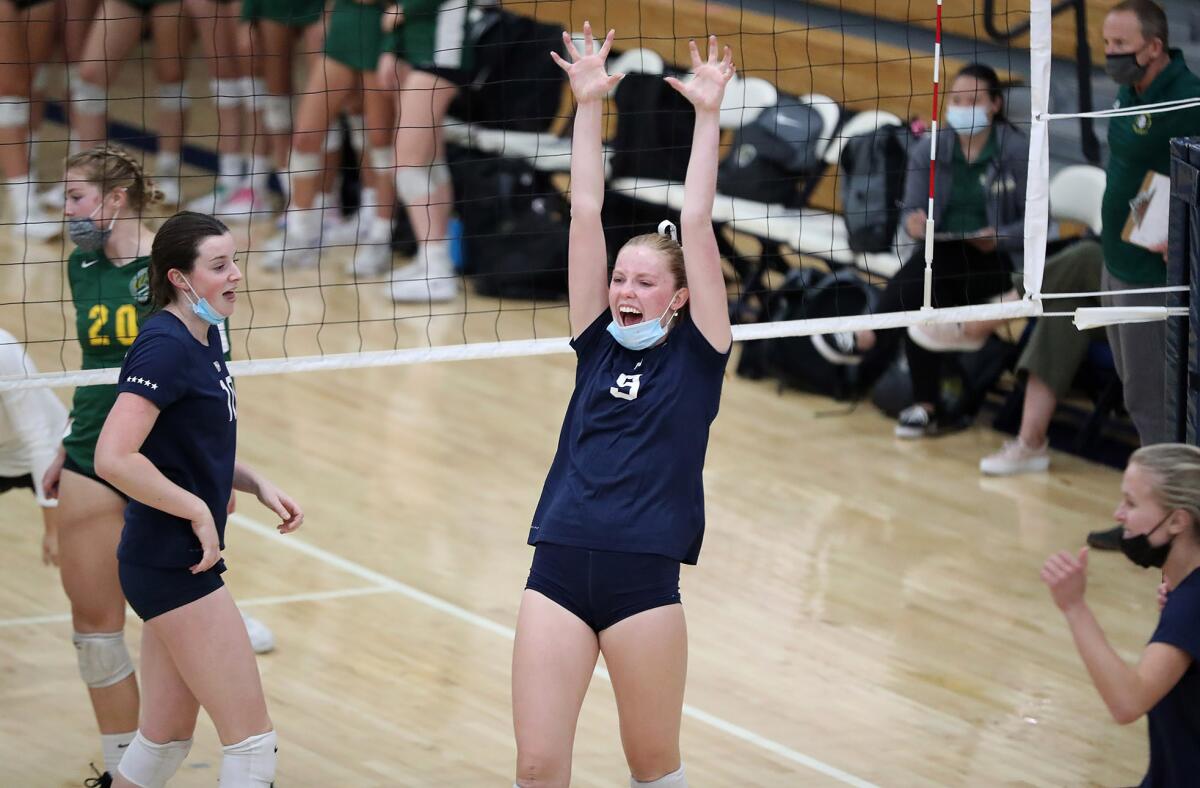 Newport Harbor celebrates against Edison in girls' volleyball.