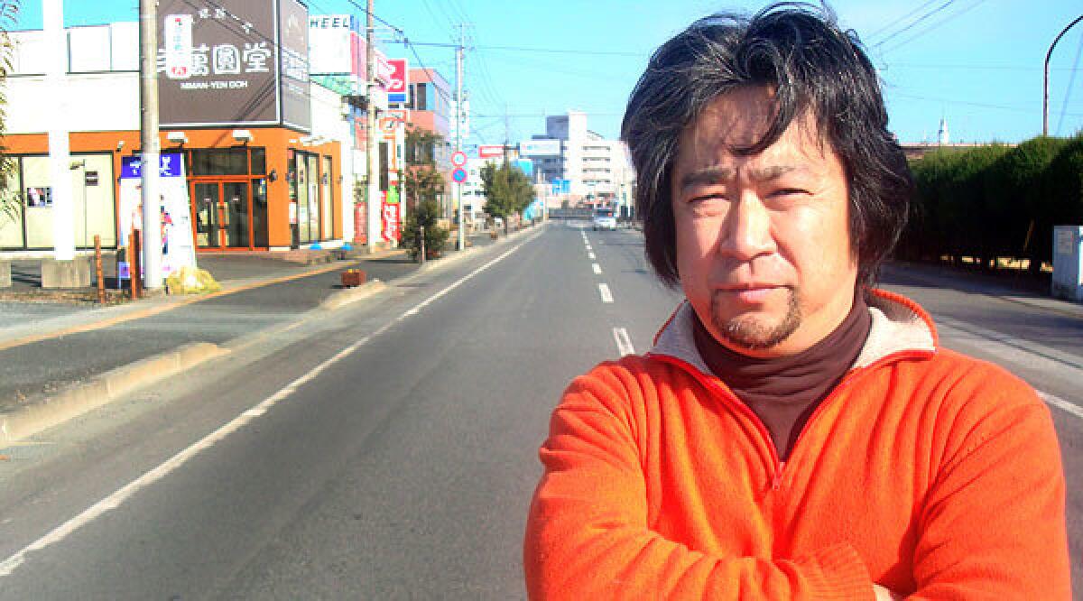 Minamisoma coffeehouse owner Hoshi Jyunichu says he is determined to remain in the town he was born in, despite the nuclear threat. "You live where you live," he said. "Home isn't a place you run away from."