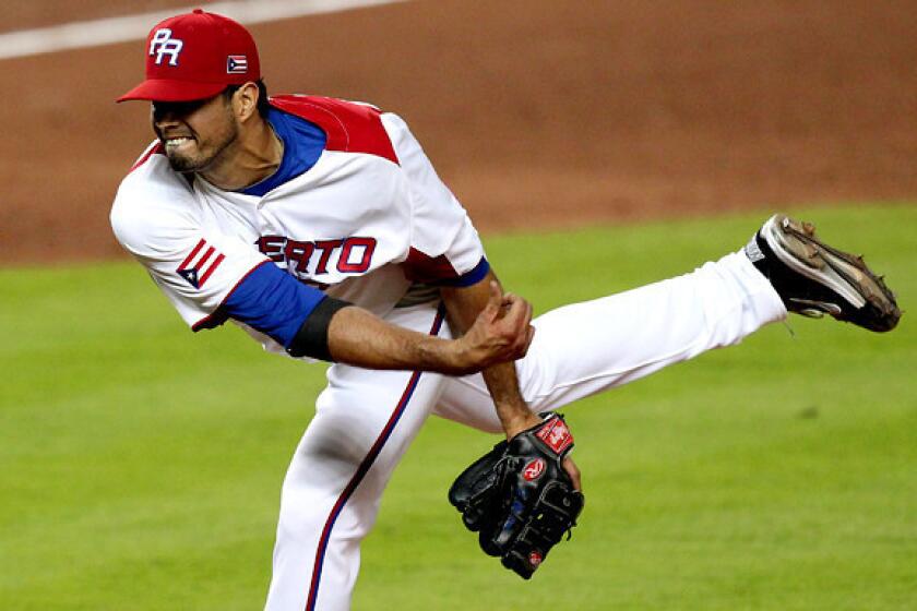 Fernando Cabrera pitches against Italy in Puerto Rico's elimination-game victory on Wednesday in Miami.