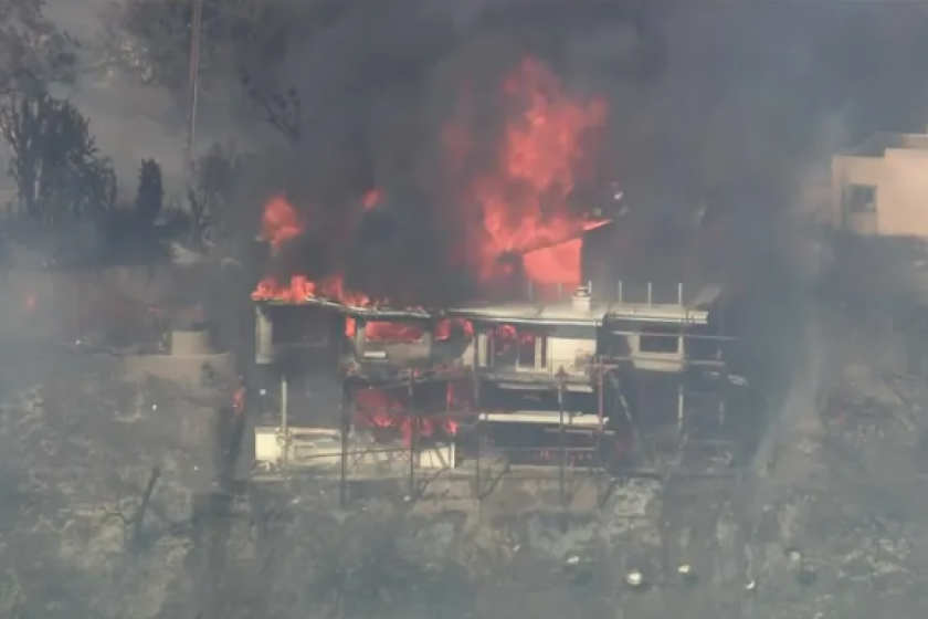 A La Habra Heights home is engulfed by fire on Monday afternoon.