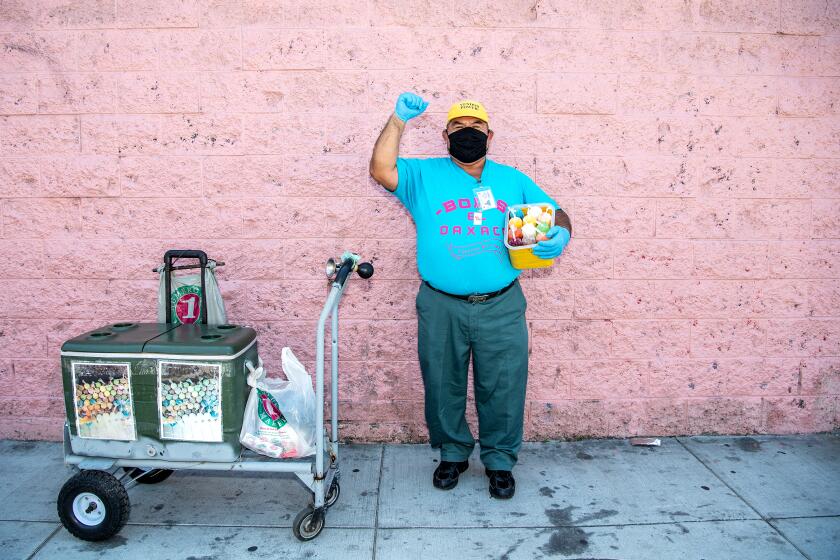 LOS ANGELES, CA - APRIL 21: Faustino Martinez in his south central neighborhood on Tuesday, April 21, 2020 in Los Angeles, CA. Martinez owns a pushcart business, "Bolis El Oaxaca", which sells mostly ice cream treats, but since the Safer At Home orders due to the COVID-19 pandemic, Martinez has seen a devastating decline in sales. (Mariah Tauger / Los Angeles Times)