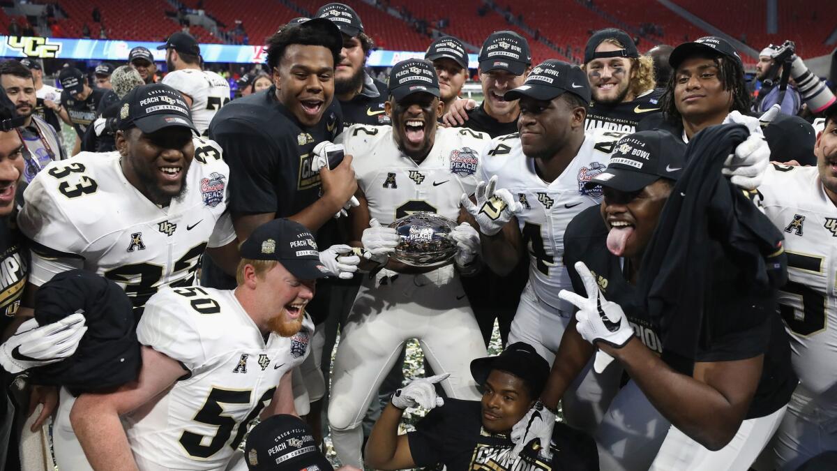 Central Florida players celebrate after defeating Auburn 34-27 in the Peach Bowl on Jan. 1.