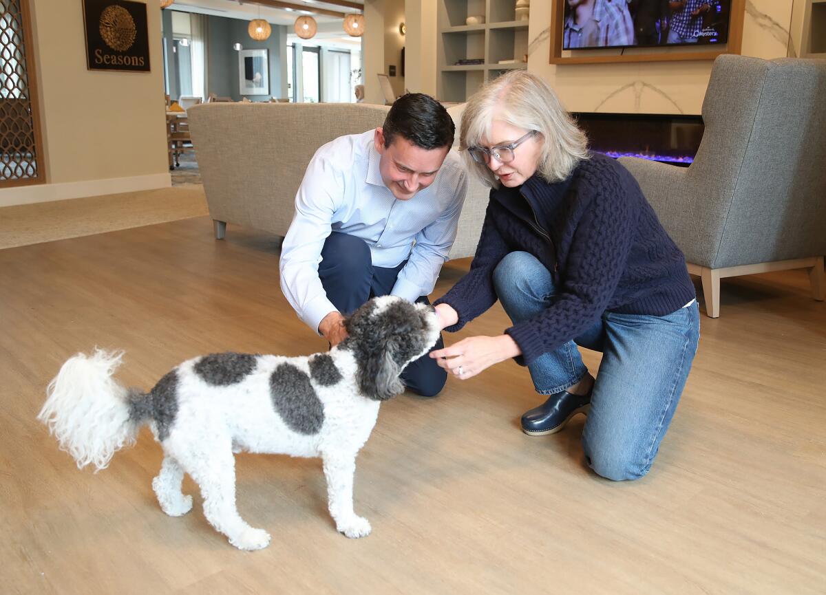 Andrew and Laura Hollinshead with their dog, Banzai, at the Watermark Laguna Niguel.