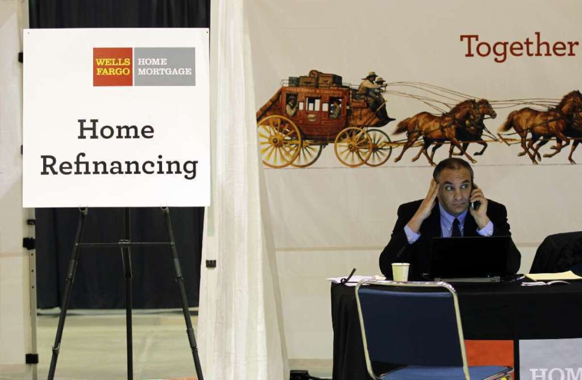 A Wells Fargo mortgage consultant is shown at a home preservation workshop.
