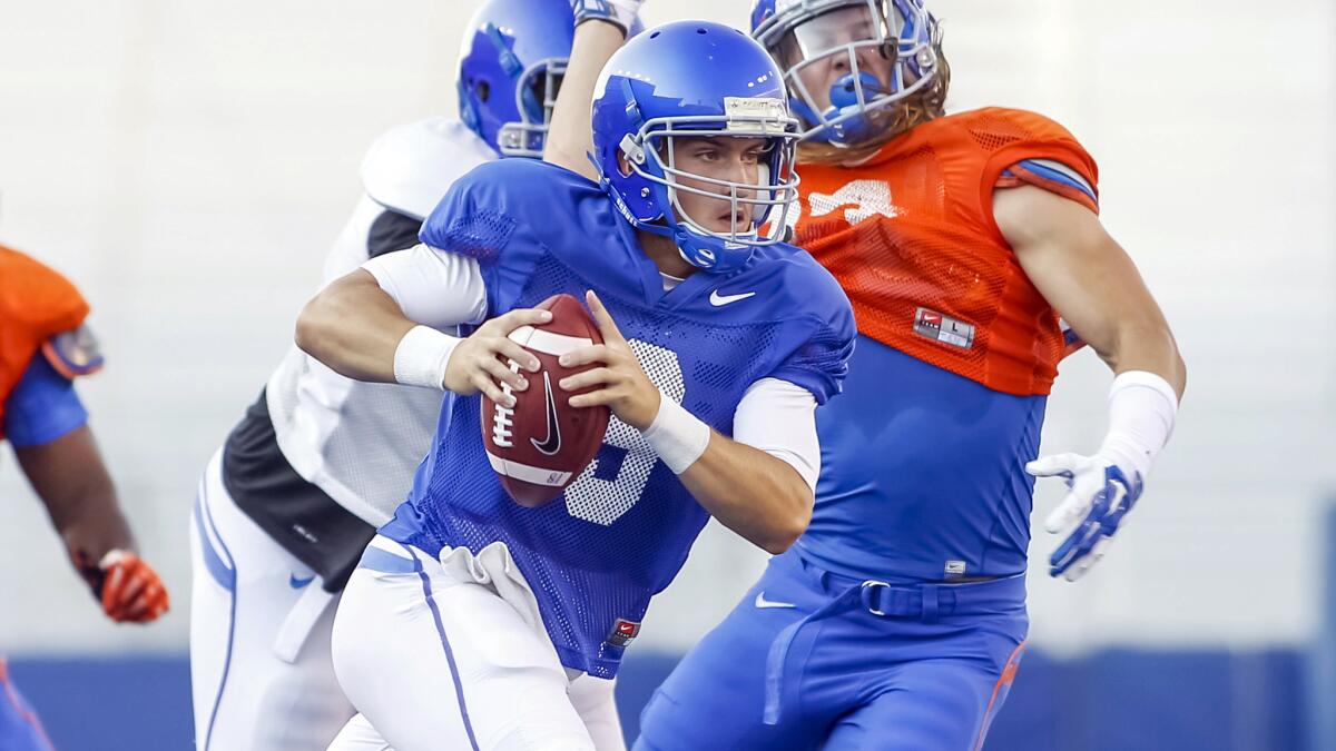 Boise State quarterback Grant Hedrick scrambles during a team practice session on Aug. 15. It seems impossible that a team such as Boise State could challenge for the national title.