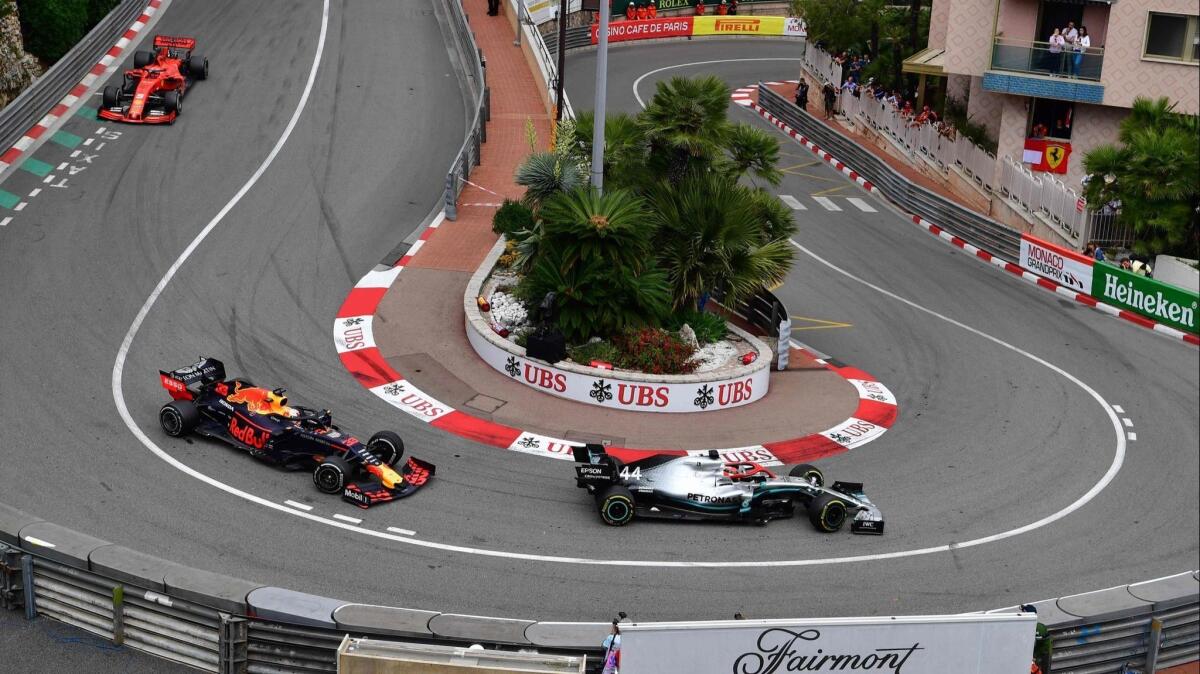 Lewis Hamilton races ahead of Max Verstappen and Sebastian Vettel on the streets of Monaco on May 26.