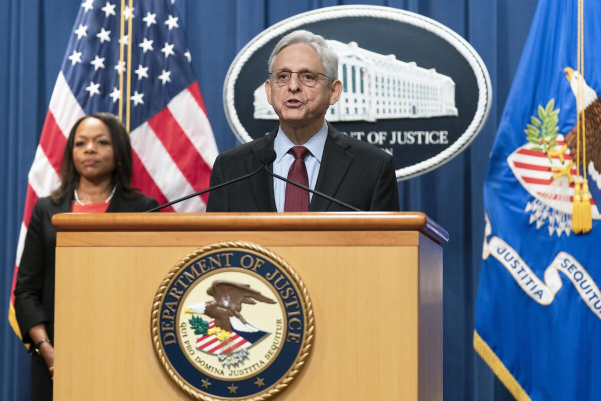 Attorney General Merrick Garland with Assistant Attorney General Kristen Clarke for the Civil Rights Division, speaks during a news conference at the Department of Justice in Washington, Thursday, Aug. 4, 2022. The U.S. Justice Department announced civil rights charges Thursday against four Louisville police officers over the drug raid that led to the death of Breonna Taylor, a Black woman whose fatal shooting contributed to the racial justice protests that rocked the U.S. in the spring and summer of 2020. (AP Photo/Manuel Balce Ceneta)