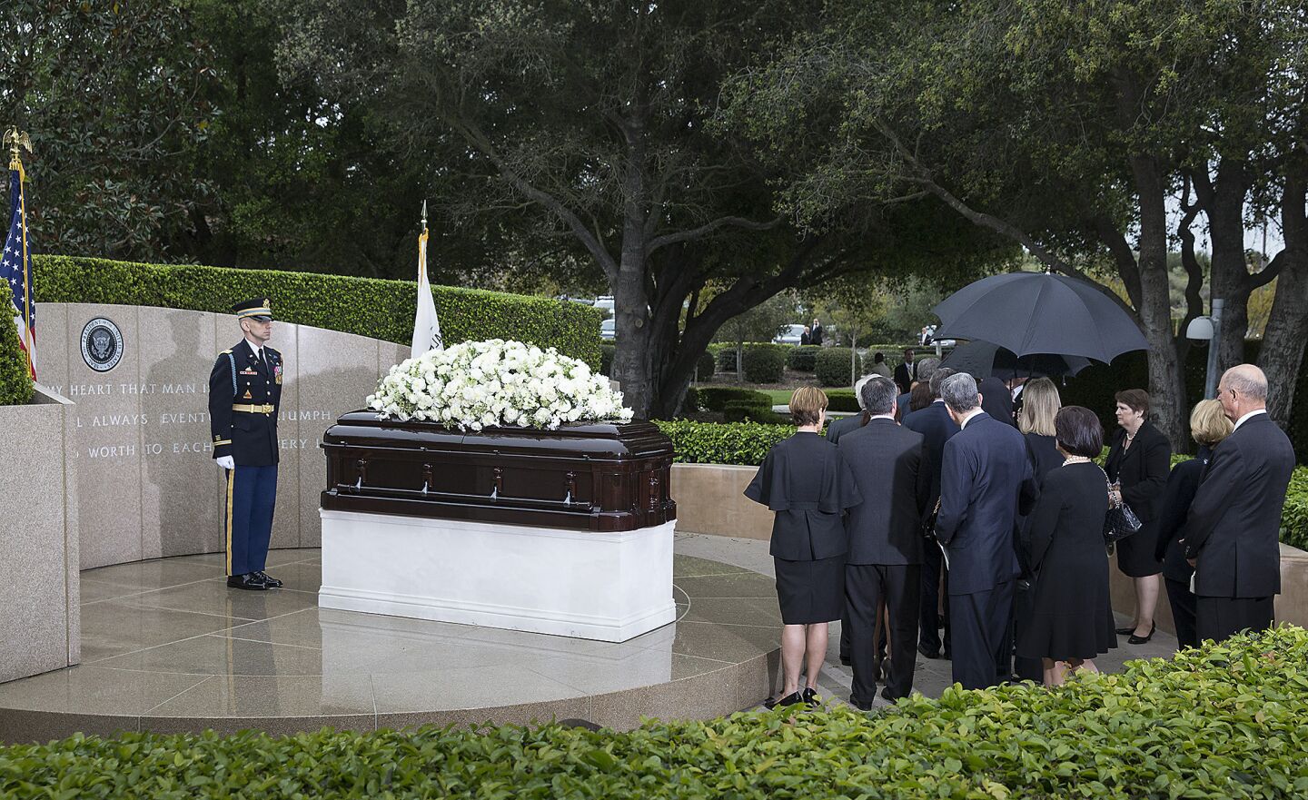 Mourners and family members pause at Nancy Reagan's gravesite at the Ronald Reagan Presidential Library in Simi Valley.