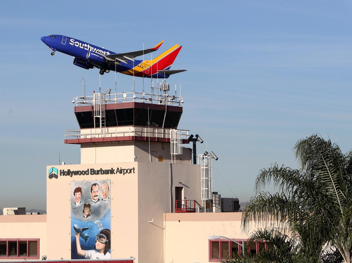A Southwest Airlines plane takes off over Hollywood Burbank Airport. 