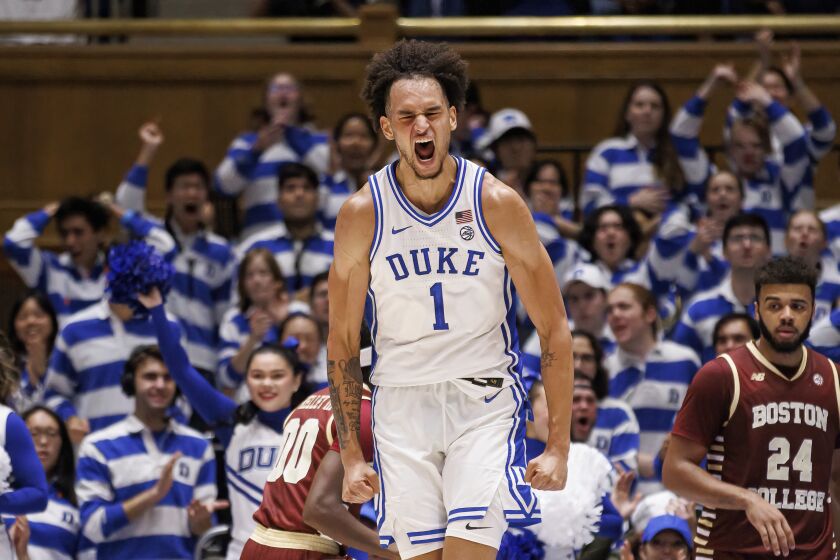 Duke's Dereck Lively II (1) celebrates after a dunk during the first half of an NCAA college basketball game against Boston College in Durham, N.C., Saturday, Dec. 3, 2022. (AP Photo/Ben McKeown)