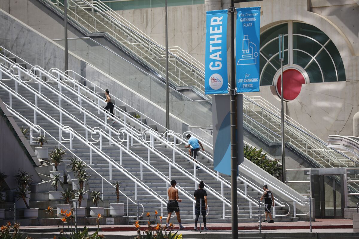 People run the steps at the San Diego Convention Center which has had many of its booked conventions canceled due to the coronavirus pandemic, shown here on April 28, 2020.