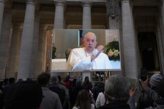A giant screen broadcasts Pope Francis delivering his blessing during the Angelus noon prayer from the chapel of the hotel at the Vatican grounds where he lives, Sunday, Nov. 26, 2023. Pope Francis says he has a lung inflammation but will go later this week to Dubai for the climate change conference. Francis skipped his weekly Sunday appearance at a window overlooking St. Peter's Square, a day after the Vatican said he was suffering from a mild flu. (AP Photo/Alessandra Tarantino)