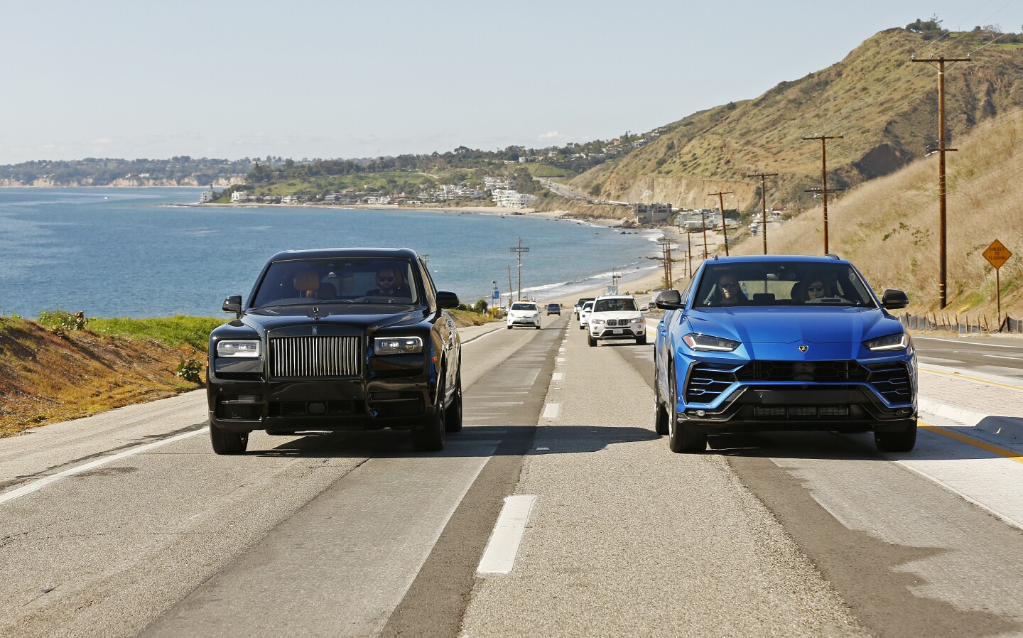 MALIBU, CA - JANUARY 21, 2020 The Lamborghini Urus in blue and the Rolls-Royce Cullinan in black are photographed in Malibu for a comparison with the rise of the UUV (ultra utility vehicle). The stars are the Lamborghini Urus and the Rolls-Royce Cullinan with a two-fold vibe; elegant and urban; and sandy/beachy/off-road.(Al Seib / Los Angeles Times)