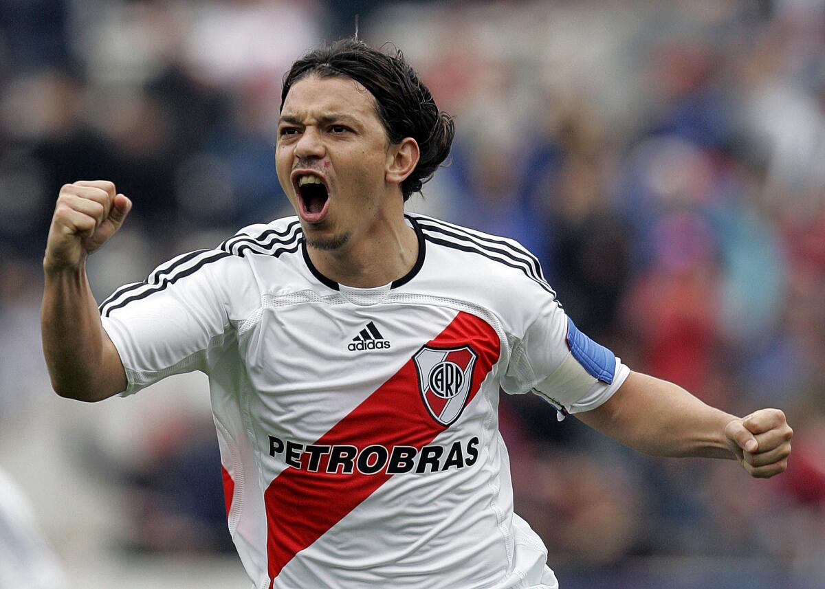 (FILES) River Plate's Marcelo Gallardo celebrates after scoring against Newell's Old Boys during their Apertura tournament match at the Monumental stadium 13 August, 2006 in Buenos Aires. Former Argentine international Marcelo Gallardo has arrived in France 29 December 2006, according to a Paris airport source, ahead of signing for Paris St Germain. The source claimed the central midfielder arrived at Paris's Charles De Gaulle airport just after midday on a flight from Buenos Aires. Gallardo is expected to sign with the French club 01 January 2007. AFP PHOTO / Juan MABROMATA (Photo credit should read JUAN MABROMATA/AFP/Getty Images) ORG XMIT: ARG296
