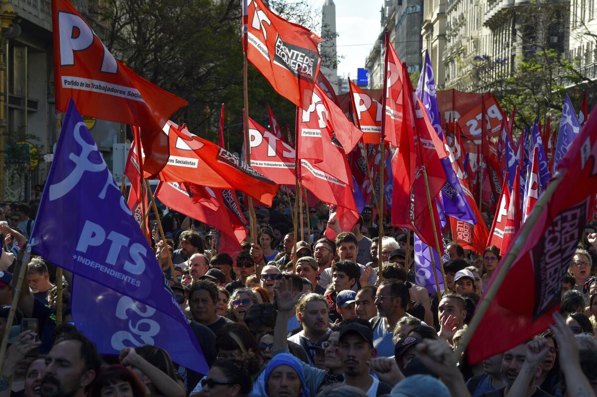 Protesters march against new economic shock measures in Buenos Aires, Argentina.