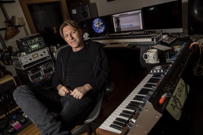 STUDIO CITY, CALIF. -- FRIDAY, JUNE 28, 2019: Musician and composer Tyler Bates sits for portraits in his studio Studio City, Calif., on June 28, 2019. (Brian van der Brug / Los Angeles Times)