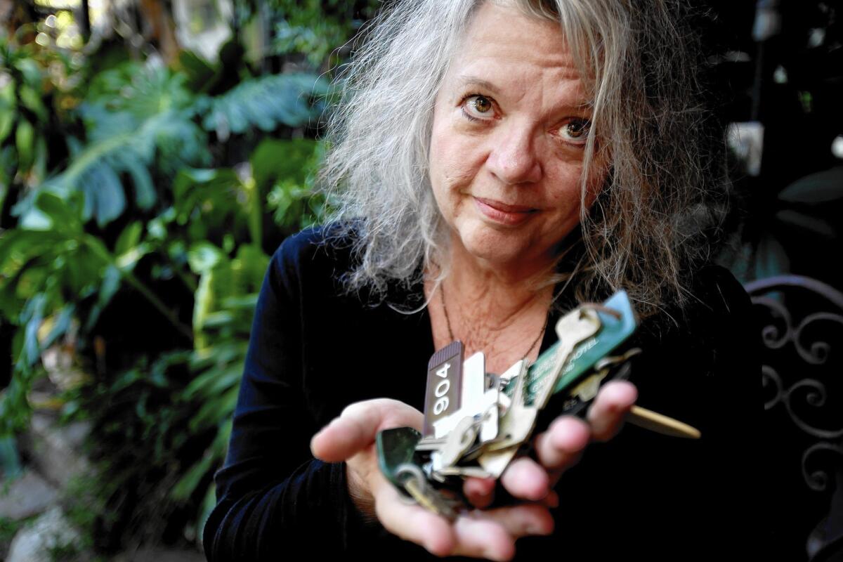 Gail Zappa, widow of musician-composer Frank Zappa, shows a handful of motel keys at her Laurel Canyon home in 2013. Zappa, who has died at the age of 70, was known both as a free spirit and as a hard-headed businesswoman.