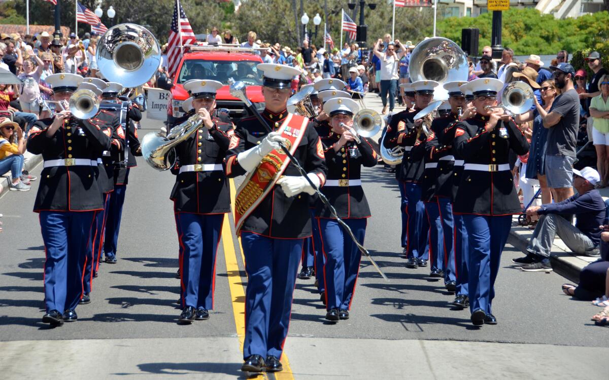 USMC-Third Marine Aircraft Wing Band, Miramar, marches to the "Marines' Hymn" during the Annual Balboa Island Parade.