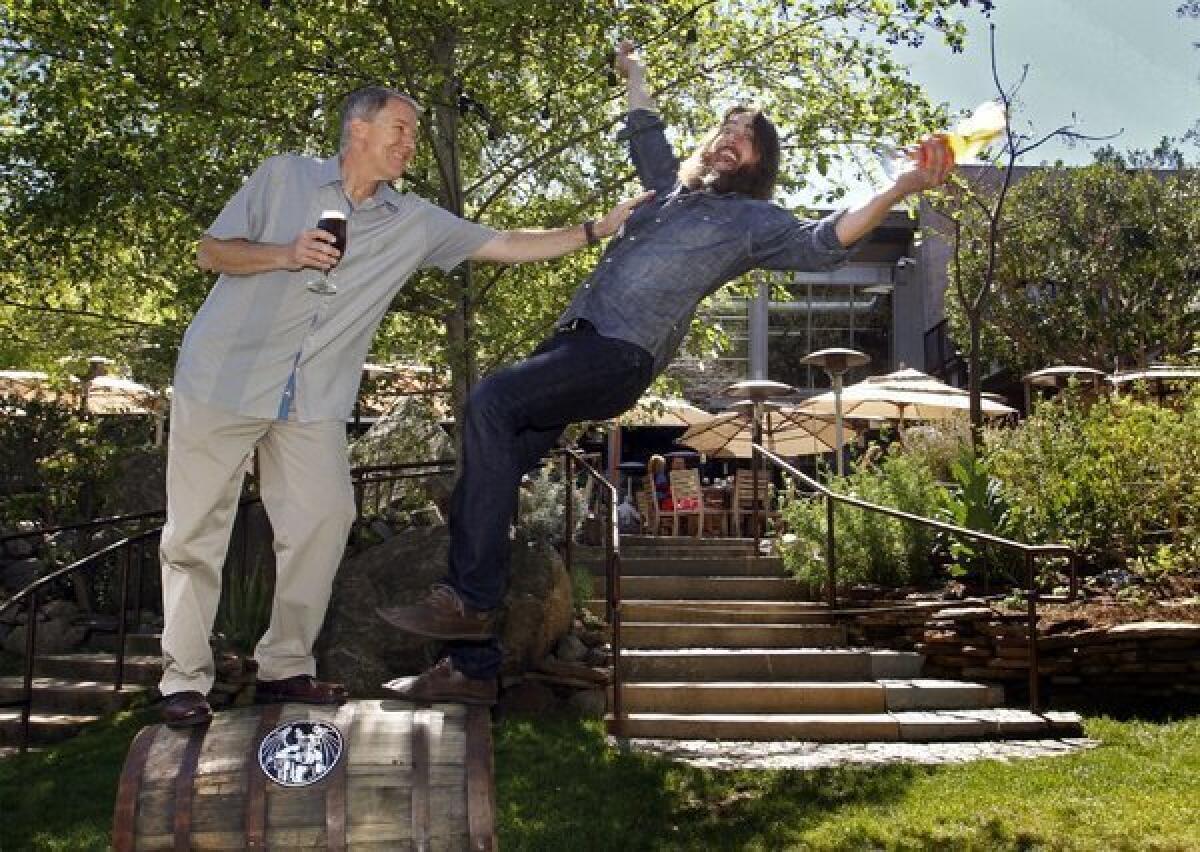 Steve Wagner, left, and Greg Koch are co-founders of Stone Brewing Co. in Escondido.