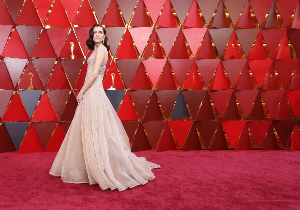 Allison Williams attends the 90th Academy Awards wearing Armani Prive.
