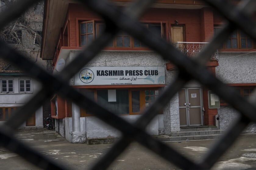 Kashmir Press Club building is pictured through a closed gate after it was sealed by authorities in Srinagar, Indian controlled Kashmir, Tuesday, Jan. 18, 2022. Last week, a few journalists supportive of the Indian government, with assistance from armed police, took control of the region’s only independent press club. Authorities shut it down a day later, drawing sharp criticism from journalist bodies. Reporters Without Borders called it an “undeclared coup” and said the region is “steadily being transformed into a black hole for news and information.” The government defended its move by citing “potential law and order situation” and “the safety of bona fide journalists.” (AP Photo/Dar Yasin)