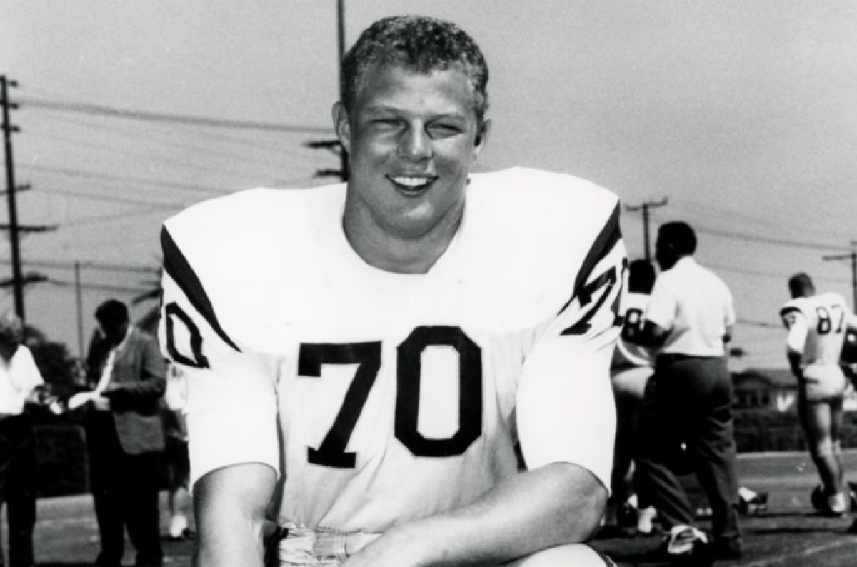 A USC helmet sits on the bench.