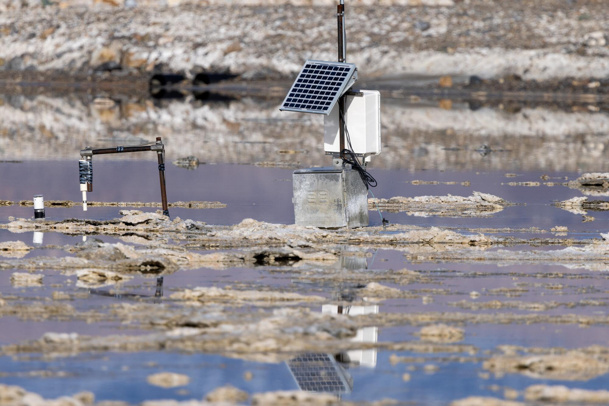 Dust  monitoring equipment rises from floodwaters at Owens Lake.