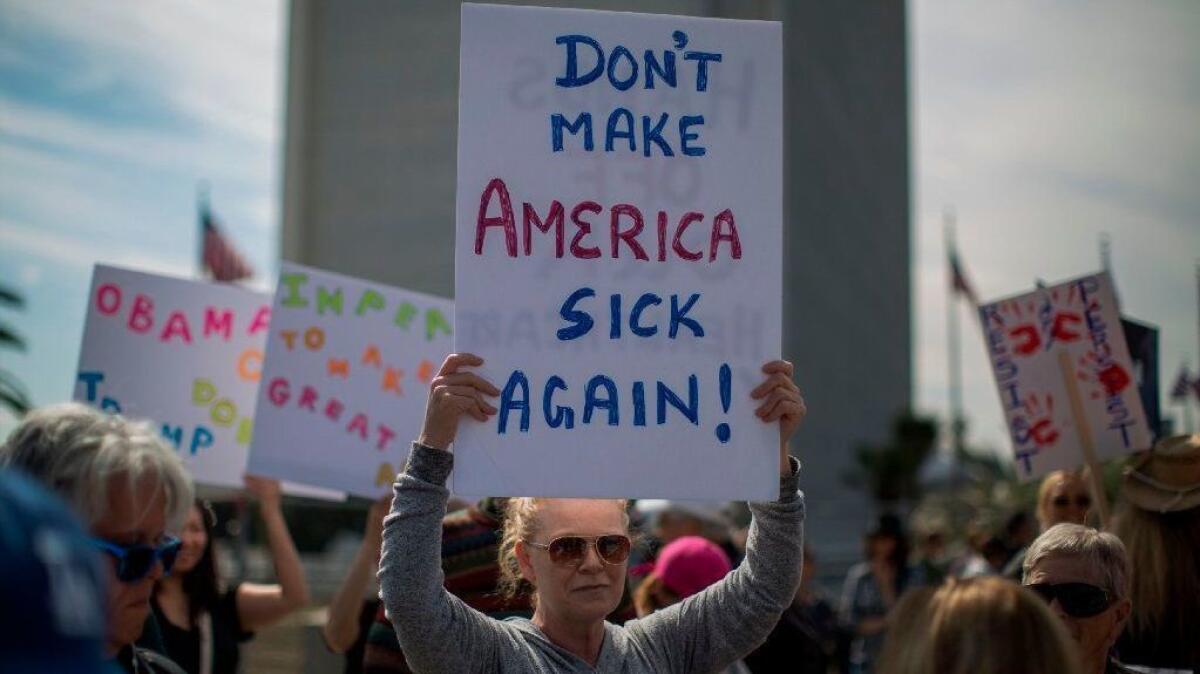 Protesters demonstrate in 2017 in Washington against Trump administration policies that threaten the Affordable Care Act.