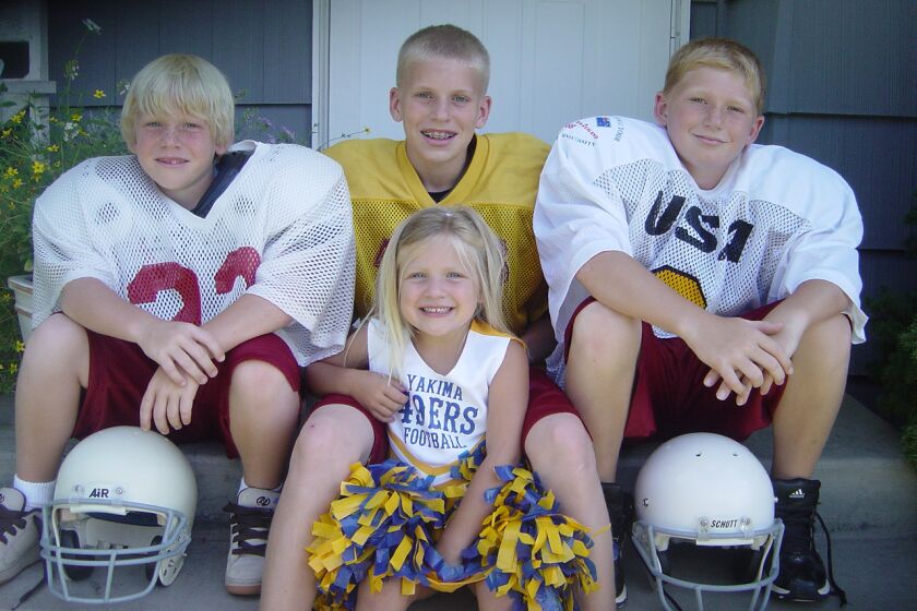 Cooper Kupp, center, sits with siblings (from left) Kobe, Katrina and Ketner.