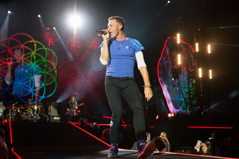 Coldplay lead singer Chris Martin performs at the Rose Bowl on Saturday night.