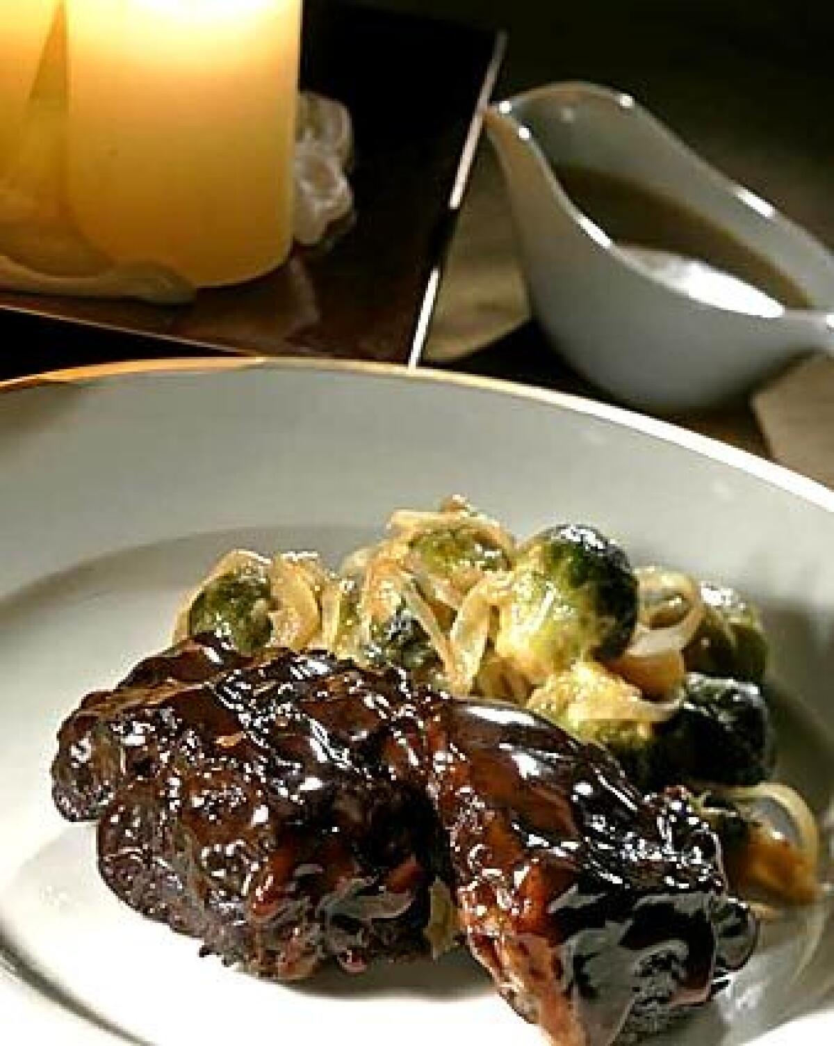 Glazed short ribs with a mustard-Cognac sauce complement the flavors of sweet-and-sour Brussels sprouts.