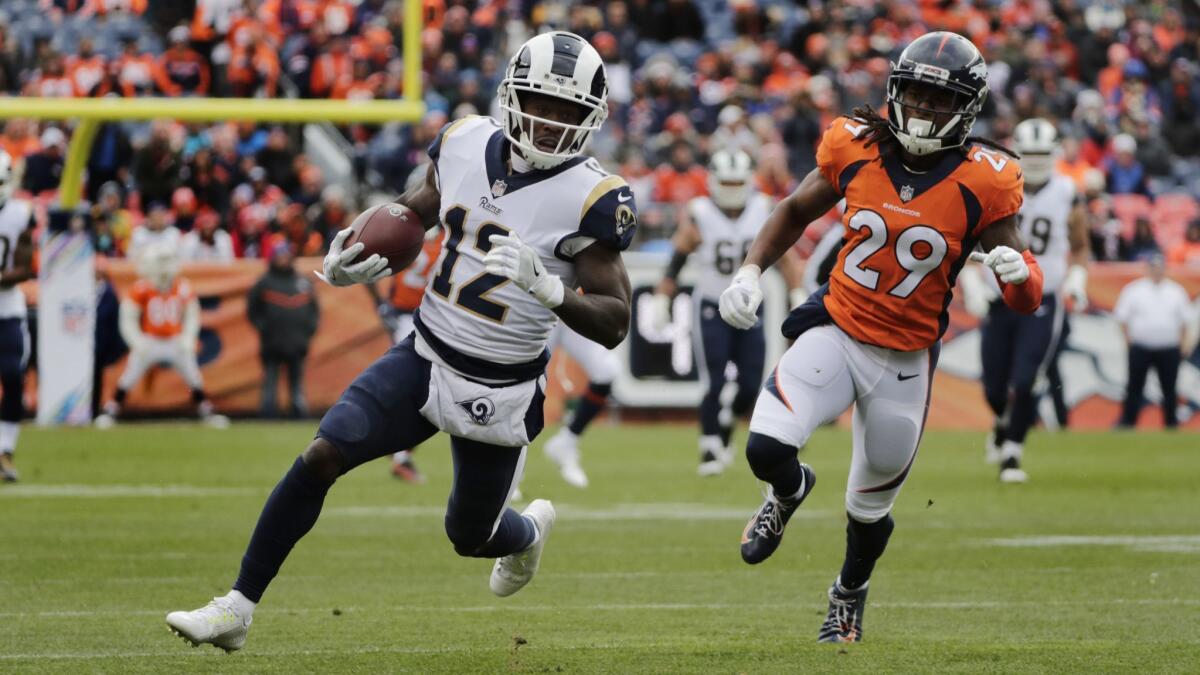 Rams wide receiver Brandin Cooks (12) outruns Denver Broncos cornerback Bradley Roby (29) for extra yardage in the first half in Week 6.
