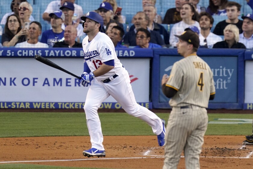 Max Muncy of the Dodgers and Padres starting pitcher Blake Snell watch the flight of Muncy's homer in the second inning on July 1, 2022.