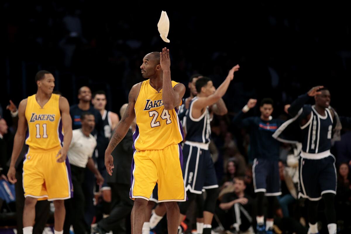 Lakers guard Kobe Bryant tosses an arm wrap after missing the final shot in the 104-103 loss to the Thunder.