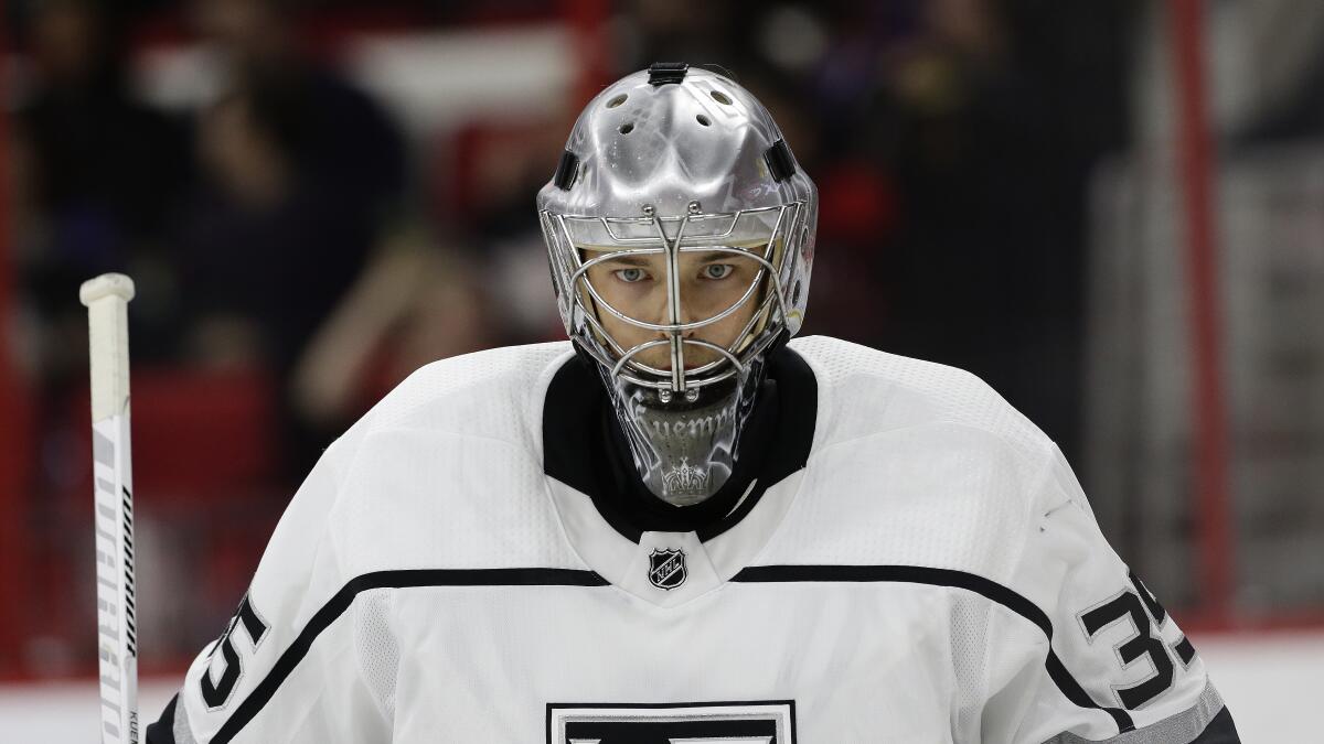 Los Angeles Kings goalie Darcy Kuemper (35) peers through his mask during the second period.
