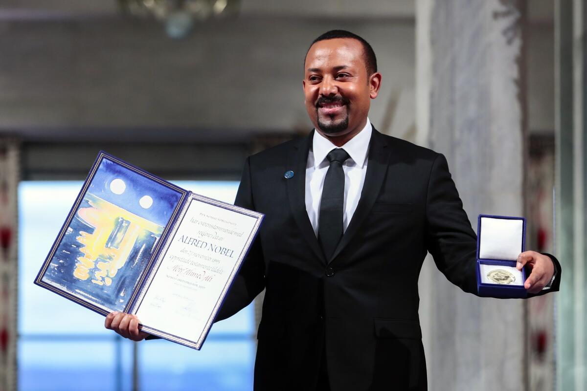 Abiy Ahmed holds his Nobel Prize