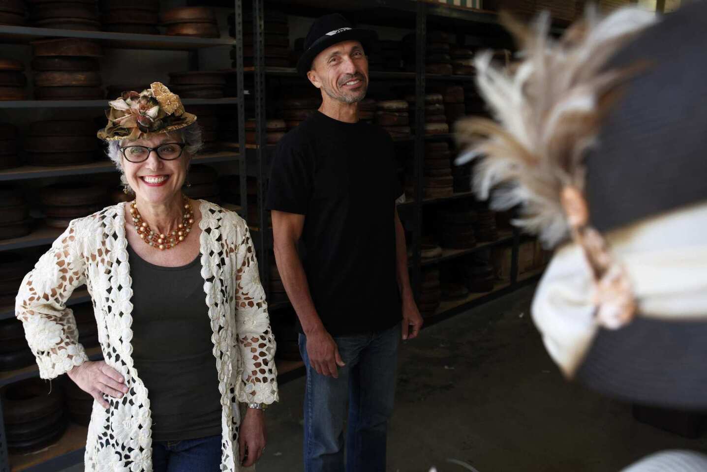 Louise, left, and Lawrence Green of Louise Green Millinery in the factory of their millinery. Green makes romantic and beautiful vintage-inspired creations that have crowned stylish women, music and movie stars since 1987.