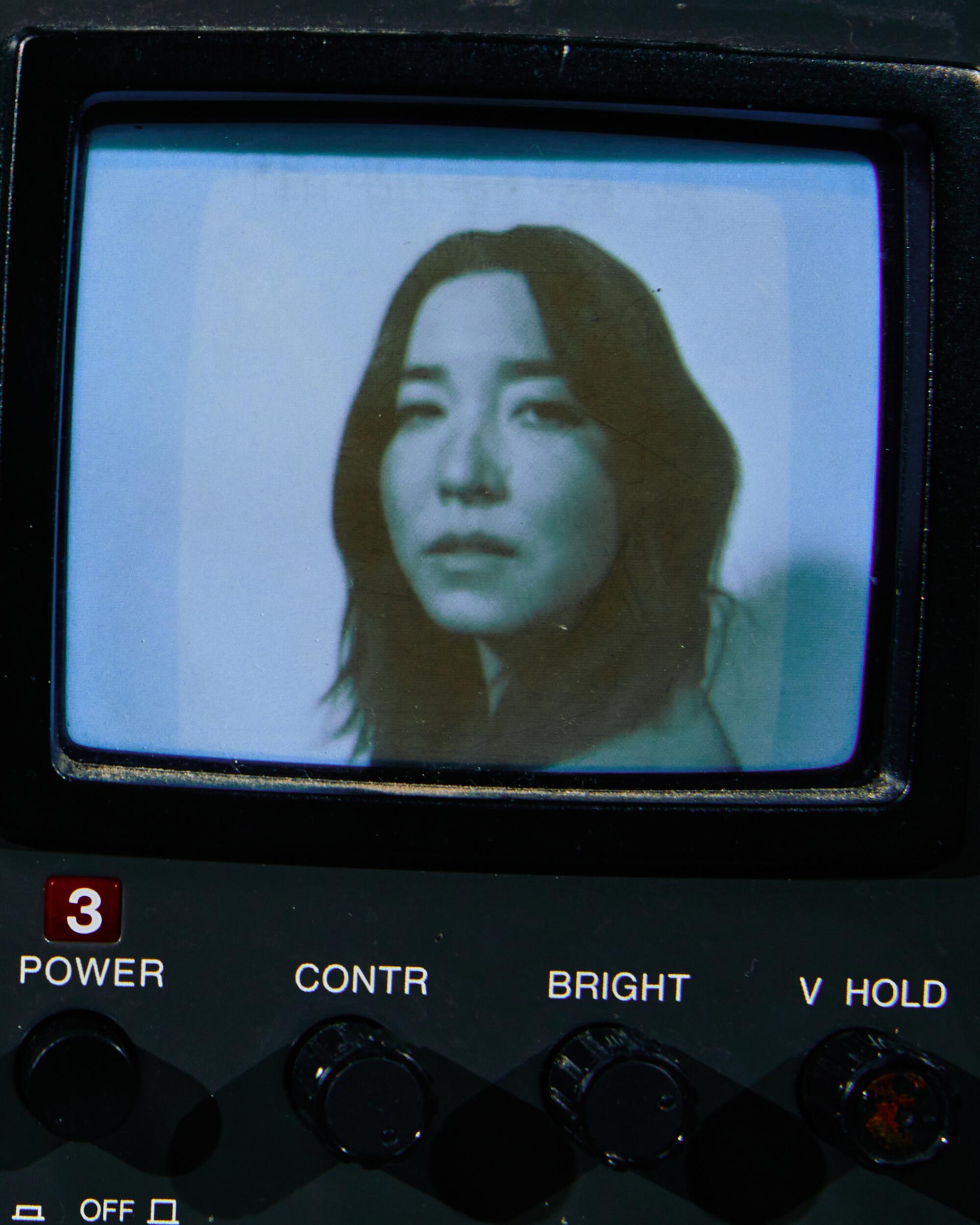A woman on a television screen.