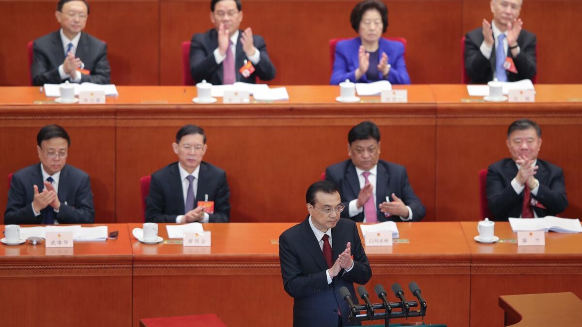 Chinese Premier Li Keqiang delivers a speech during the opening of the second session of the 13th National People's Congress on March 5 in Beijing.