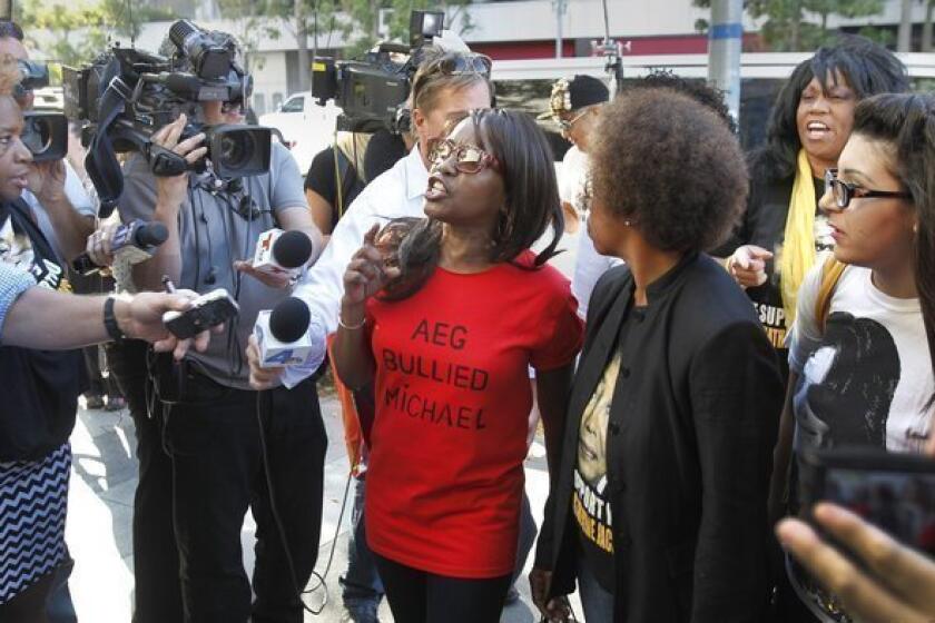 Michael Jackson fans from left, Karlene Taylor, Yvonne Francis, Latrenda White and Jamie Lee, speak out against AEG Live. A jury found Wednesday that AEG Live was not liable in the death of the pop superstar.
