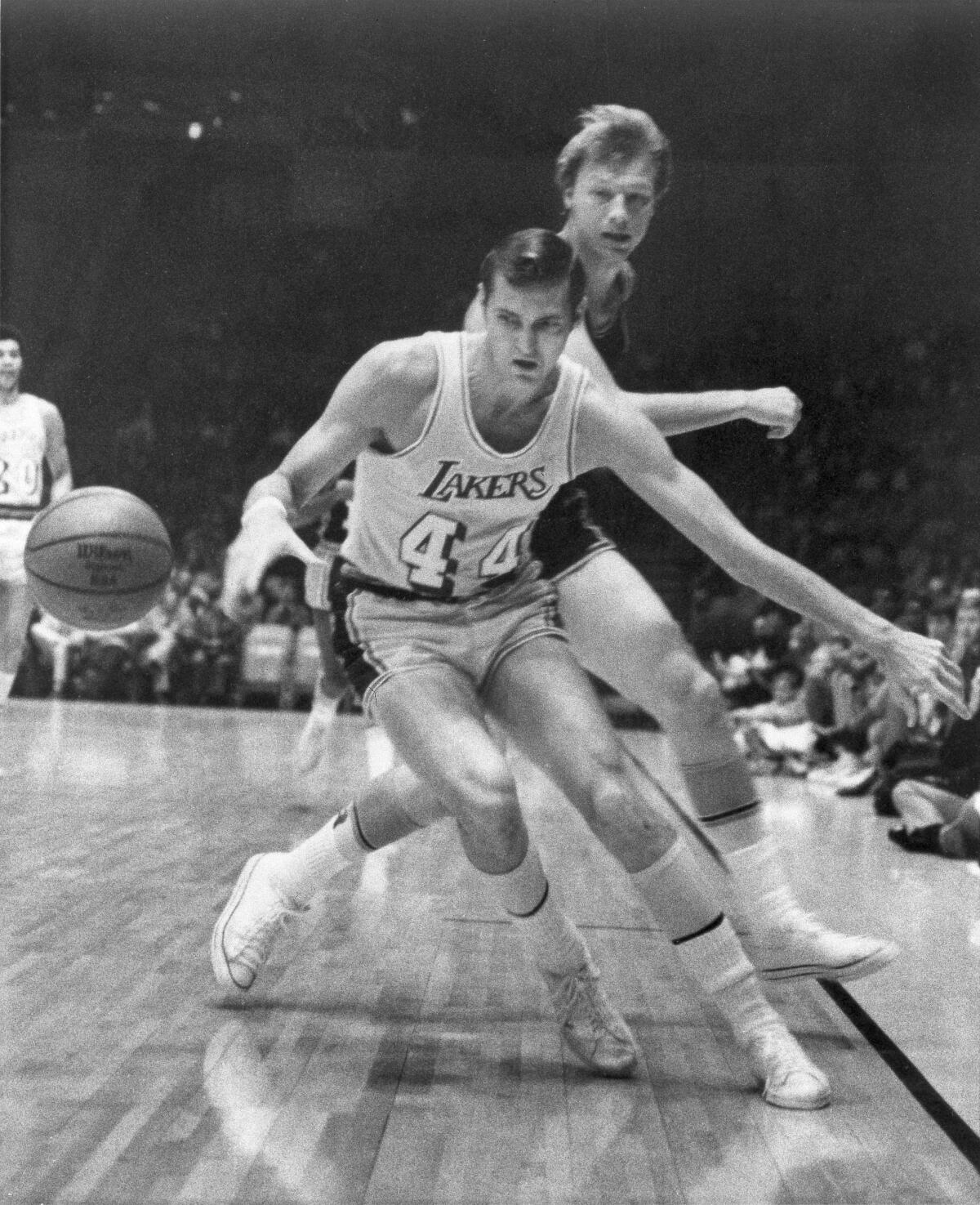 Jerry West steals the ball from Baltimore Bullets' Jack Marin on Nov. 24, 1969, at the Forum.