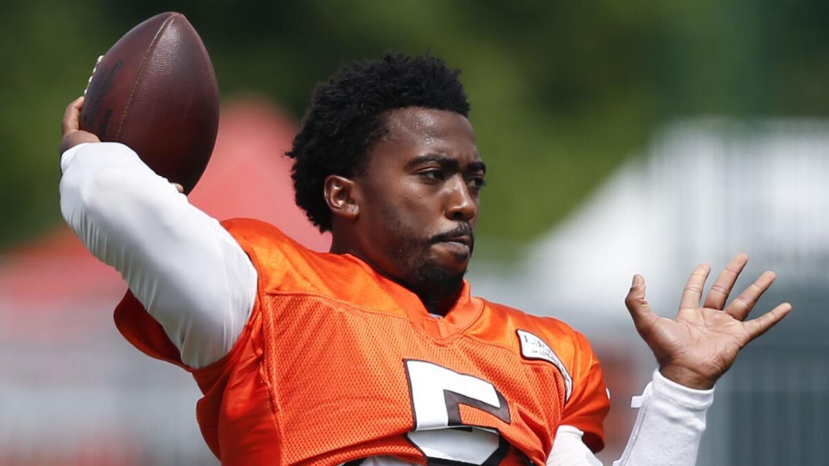 Tyrod Taylor warms up during training camp.
