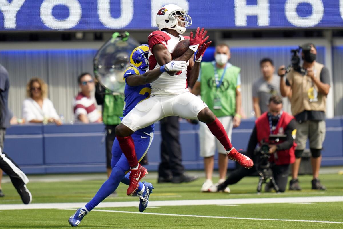 Arizona Cardinals wide receiver A.J. Green makes a touchdown catch in front of Rams defensive back David Long.