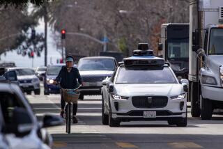 Santa Monica, CA - February 21: Passengers ride in an electric Jaguar I-Pace car outfitted with Waymo full self-driving technology in Santa Monica Tuesday, Feb. 21, 2023. (Allen J. Schaben / Los Angeles Times)