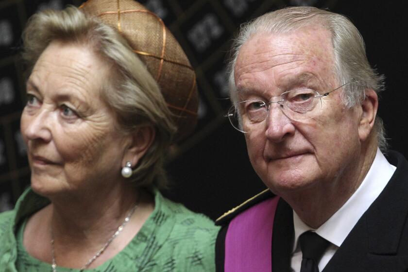 Queen Paola and King Albert II of Belgium are reportedly struggling to adjust to their $1.2-million annual pension after giving up the $15.4-million yearly stipend for reigning royals when he abdicated in July. The couple are shown here at the July 21 ceremonial transfer of power to son Philippe.