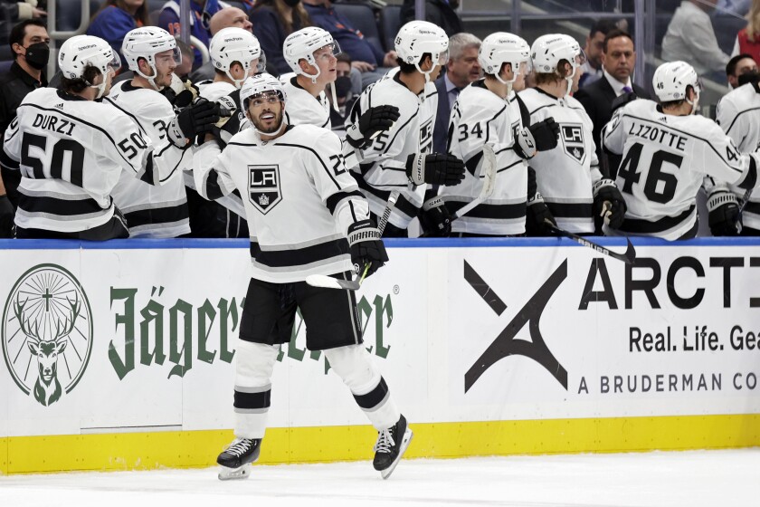 Los Angeles Kings center Andreas Athanasiou (22) celebrates scoring a goal in the second period of an NHL hockey game against the New York Islanders on Thursday, Jan. 27, 2022, in Elmont, N.Y. (AP Photo/Adam Hunger)