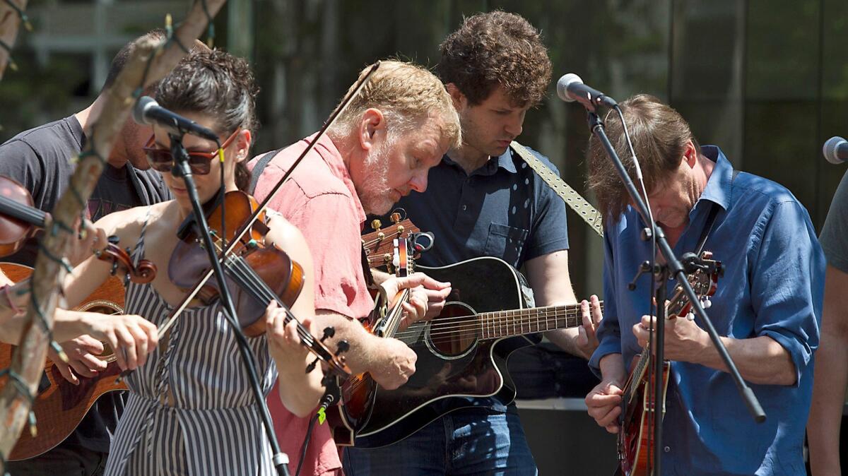 Cast members from "Once," opening this weekend at South Coast Repertory, perform in a concert Aug. 23.