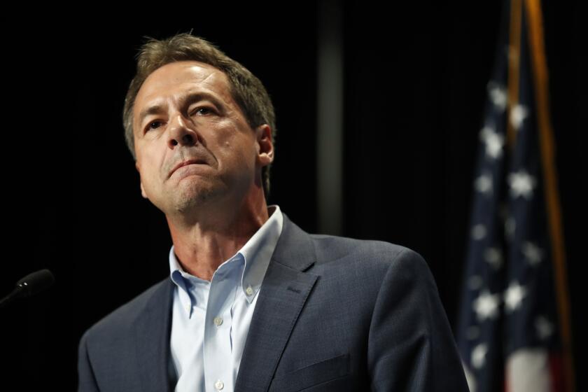 FILE - In this Sunday, June 9, 2019, file photo, Democratic presidential candidate Steve Bullock speaks during the Iowa Democratic Party's Hall of Fame Celebration, in Cedar Rapids, Iowa. Bullock announced Monday, Dec. 2, 2019, that he is ending his Democratic presidential campaign. (AP Photo/Charlie Neibergall, File)