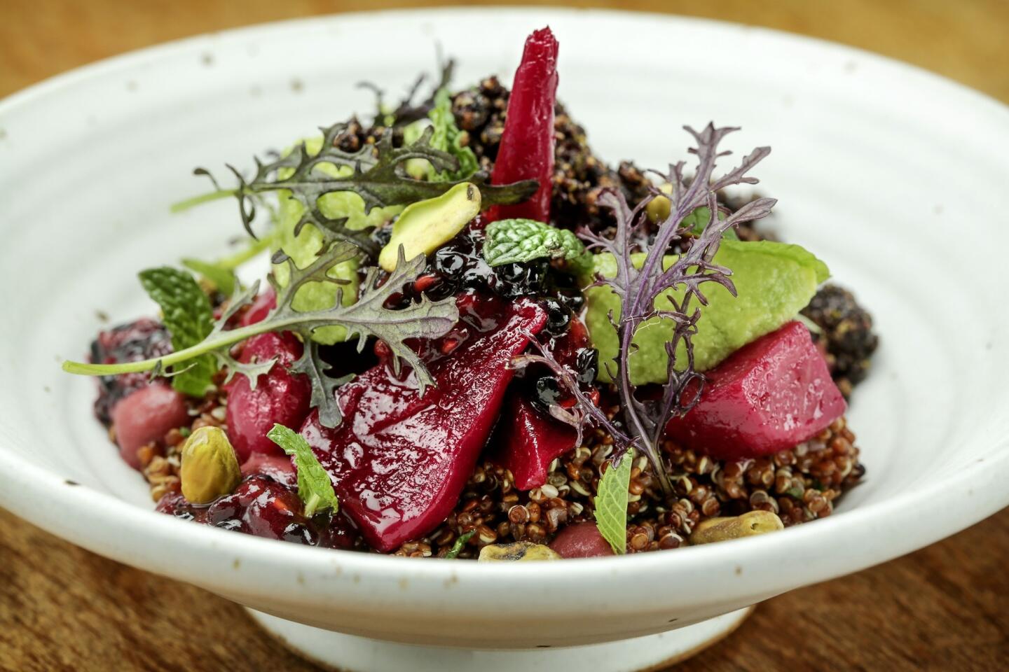 Roasted beets and purple quinoa in a rustic pottery bowl, topped with herbs, crisply roasted pistachios, chunks of buttery Reed avocado and slightly unripe mashed berries. Rustic Canyon's menu reaches higher under chef Jeremy Fox.