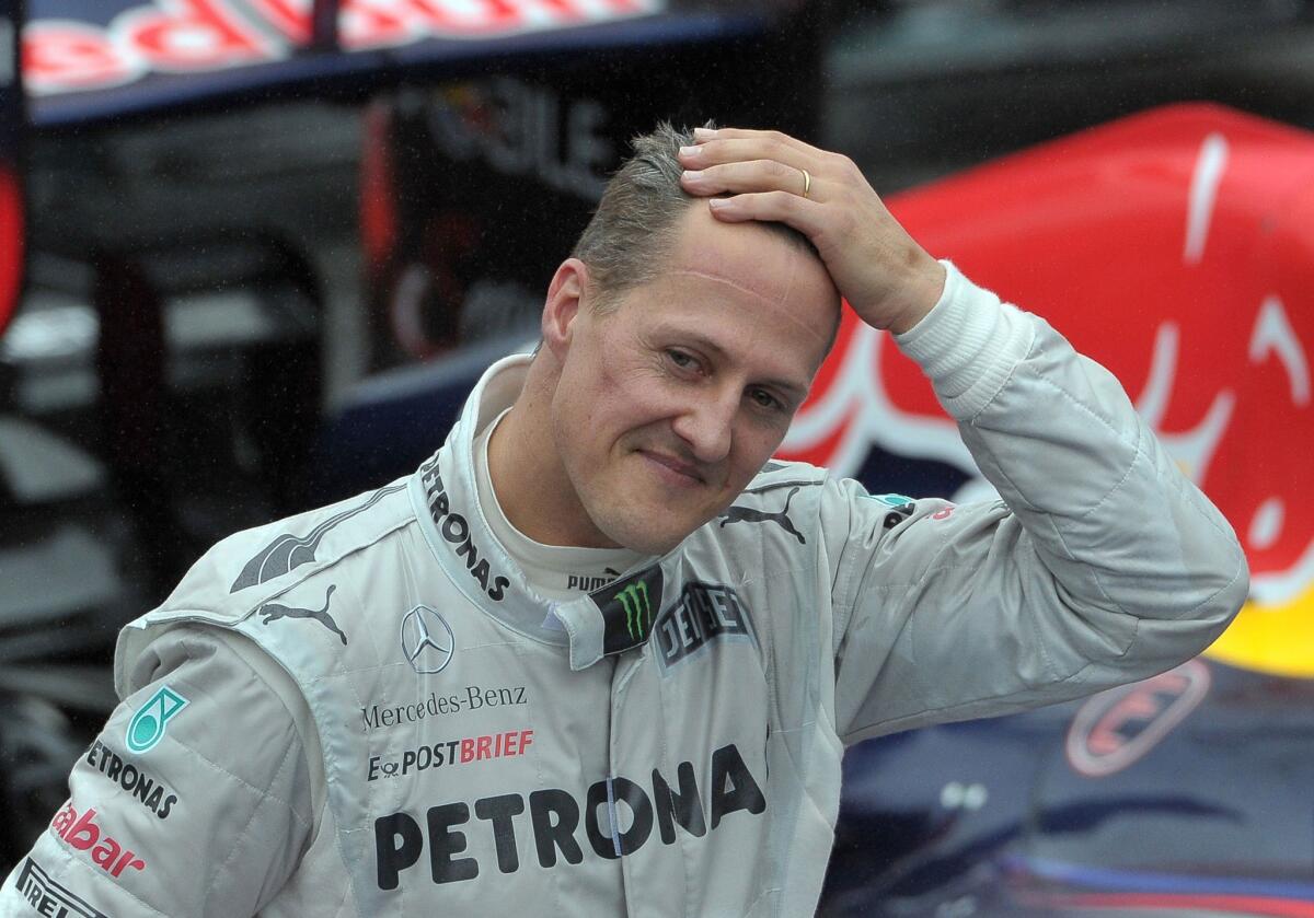 A doctor says Formula One driver Michael Schumacher, shown in 2012, is making some progress in his recovery from a skiing injury.